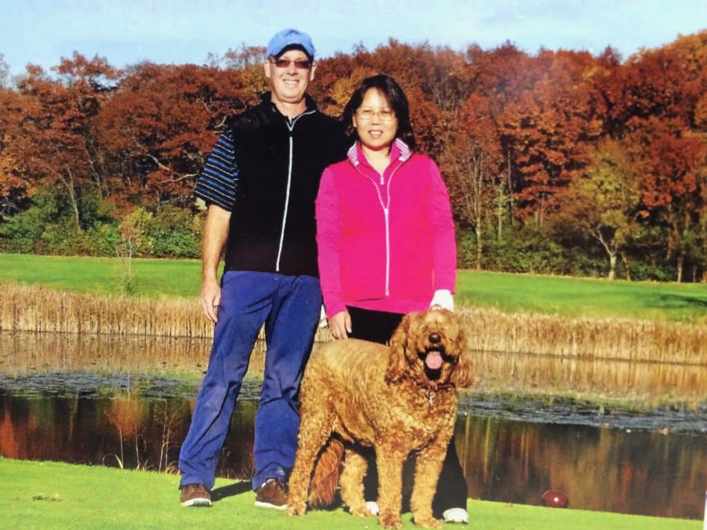 Sunshine Acre's Irish Goldendoodle Gallery of adult Goldendoodle with happy owners