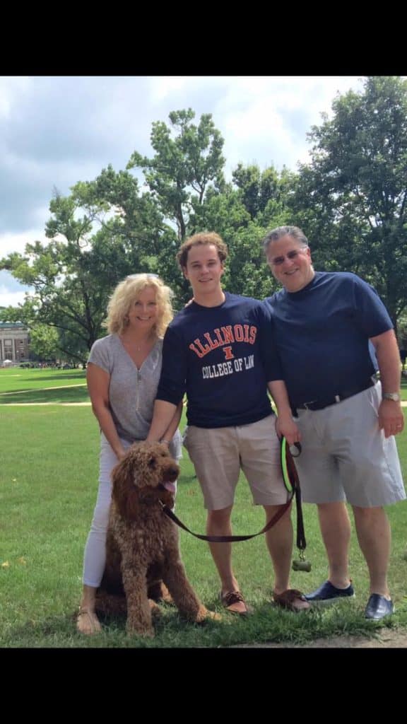 Sunshine Acre's Irish Goldendoodle Gallery of adult Goldendoodle with happy owners